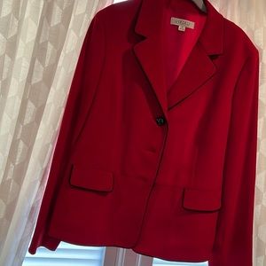 Woman’s red blazer with black trim fully lined